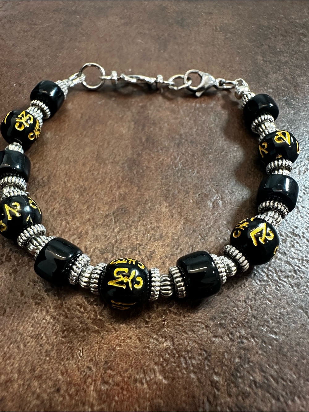 Black Handmade Beaded Bracelet with Gold Script Accents